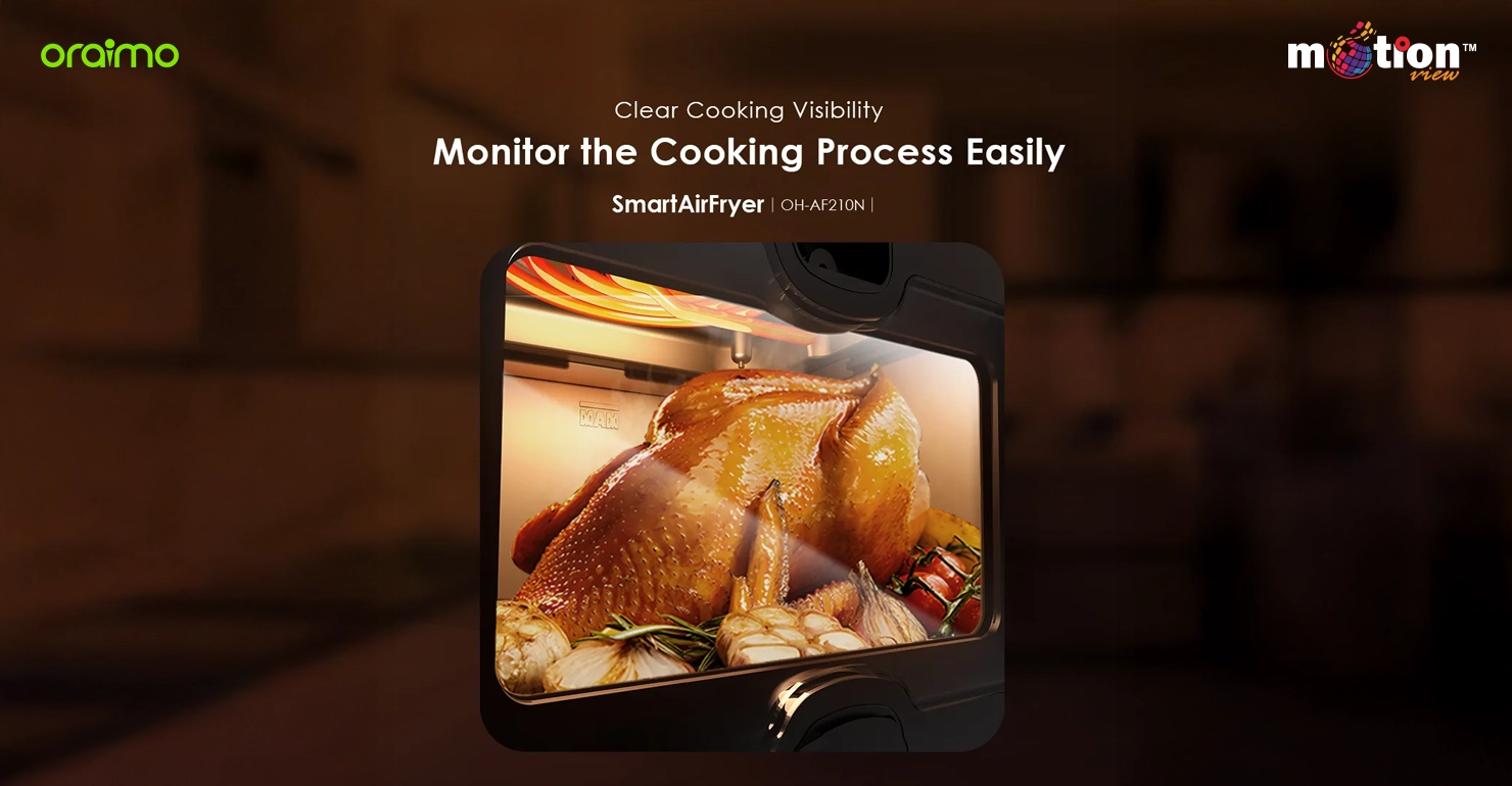 Clear viewing window of the Oraimo SmartAirFryer 5L showing a whole chicken cooking to monitor progress easily.