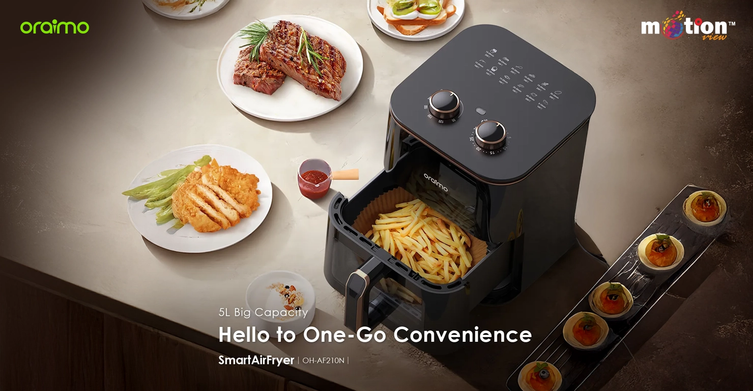 Overhead view of the Oraimo 5L SmartAirFryer showing the large capacity basket filled with fries surrounded by prepared meals.