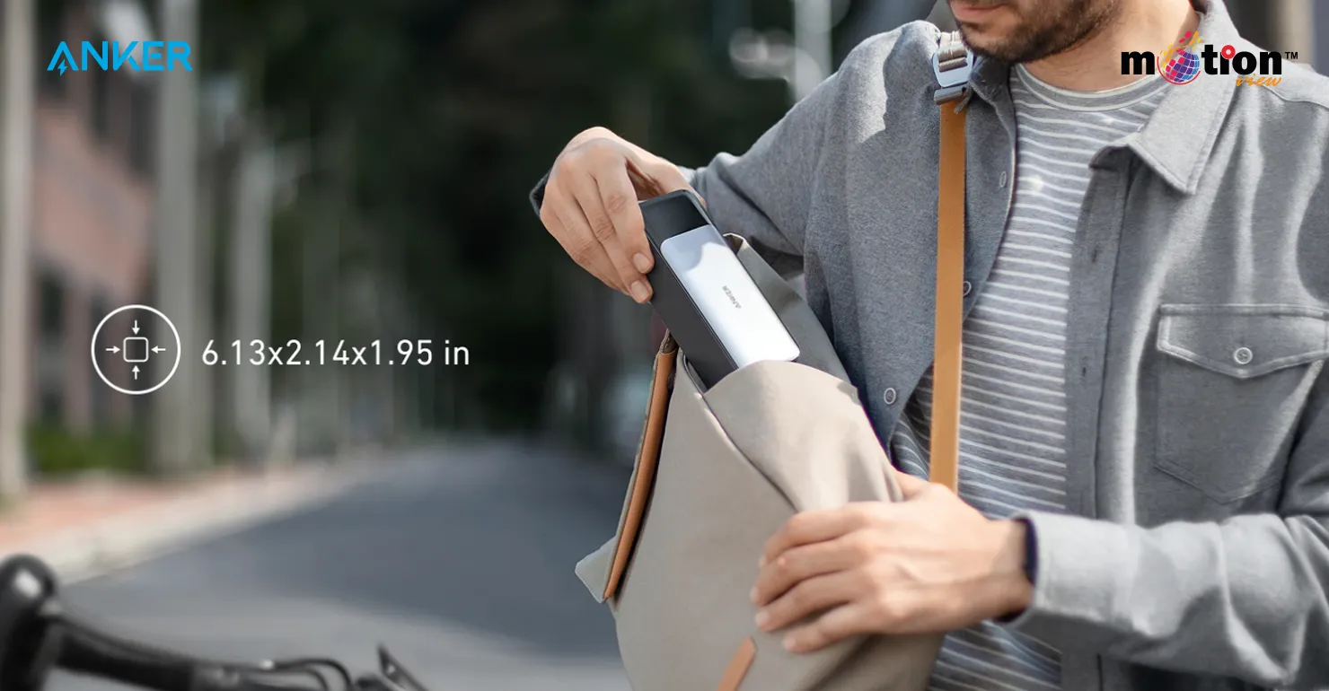 A commuter easily sliding the travel-friendly, compact Anker 737 PowerCore 24K 140W Power Bank into a messenger bag